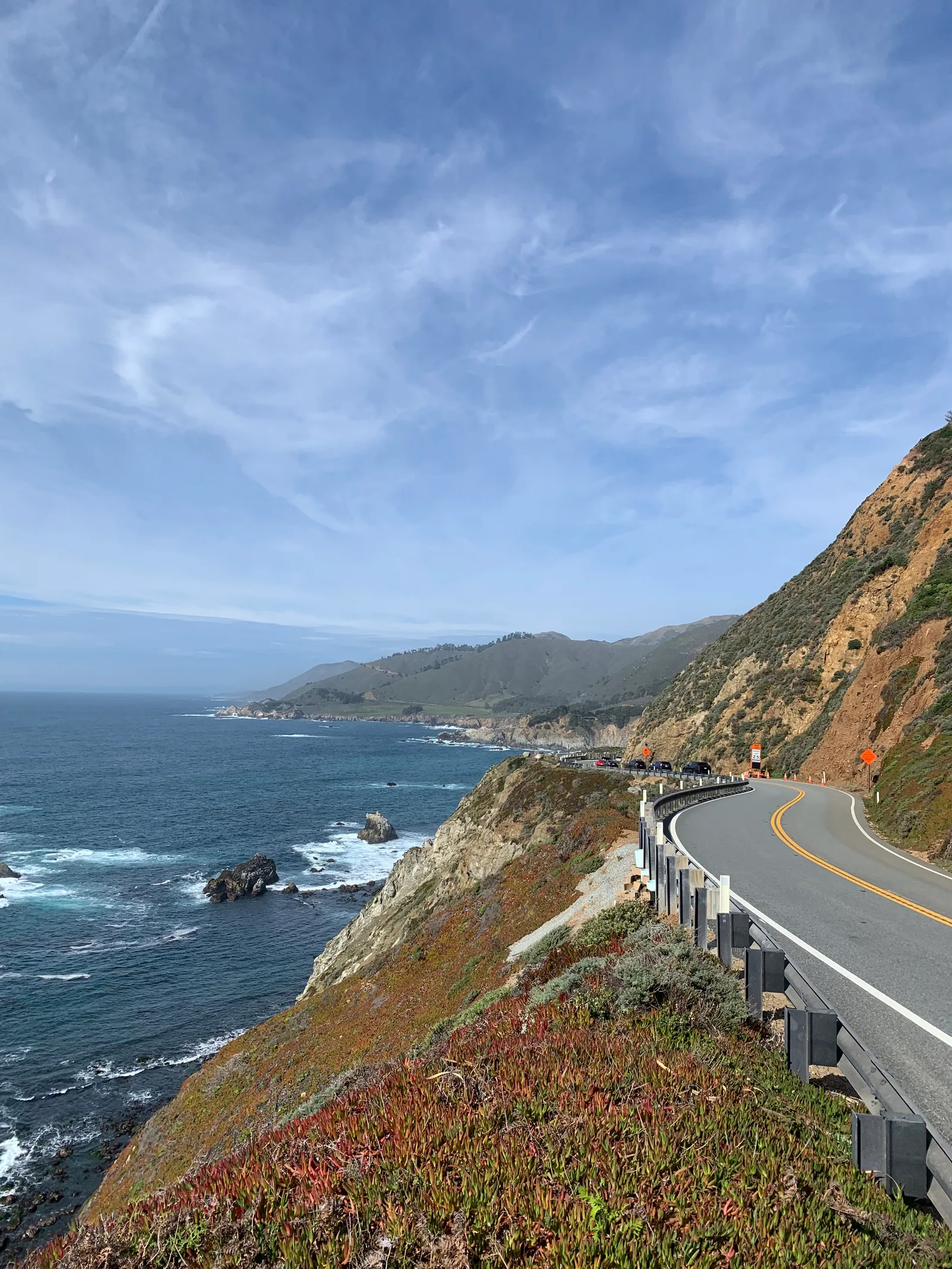 A winding road following the ocean cliffs